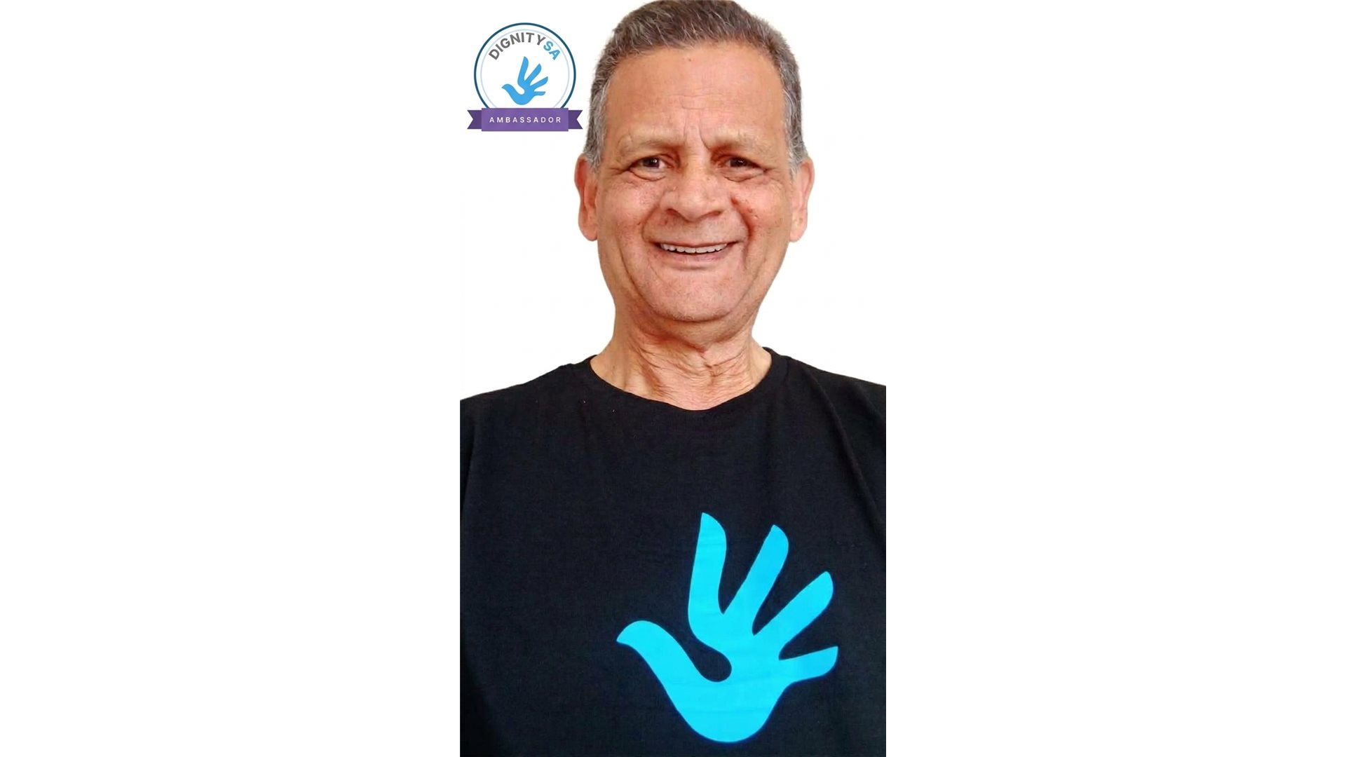 Graham Lawrence, DignitySA Ambassador, in a DignitySA t-shirt